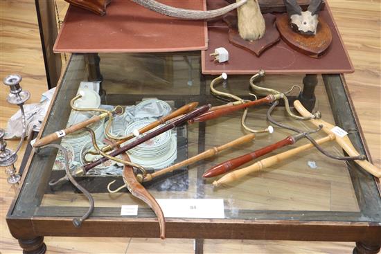 Eight 19th century hanging lawyers wig and gown stands or hangers